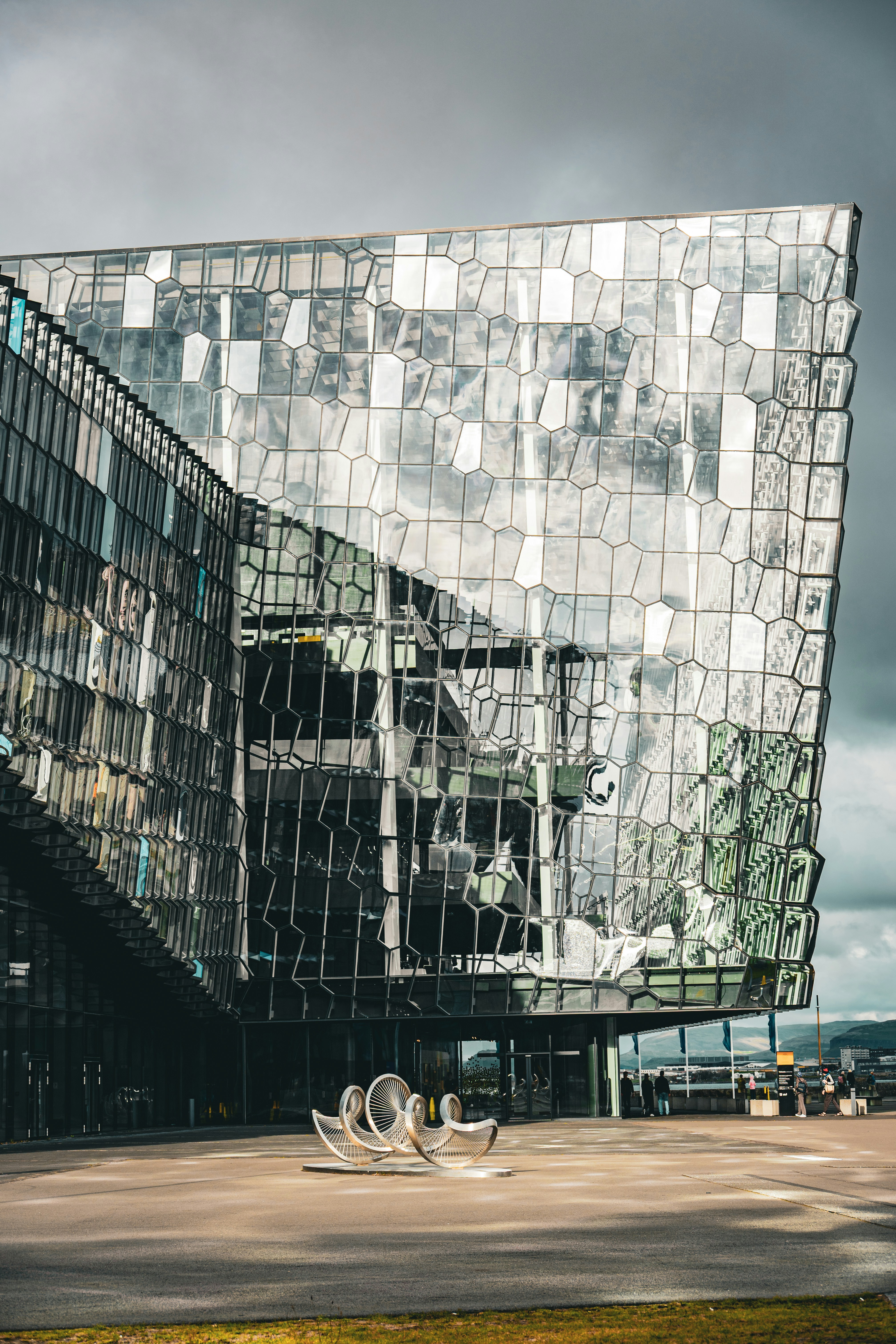 Modern Icelandic architecture with large panoramic windows reflecting twilight sky